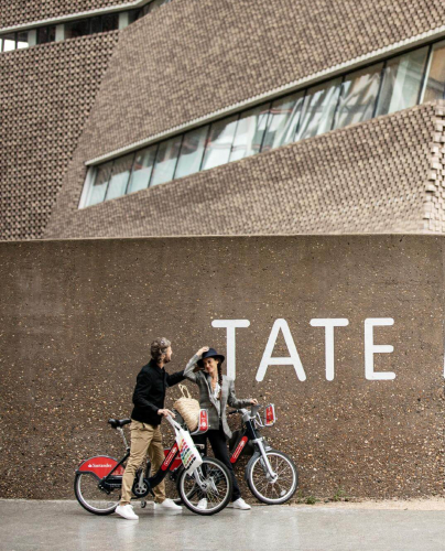 Two people outside the Tate Modern near Elephant Park