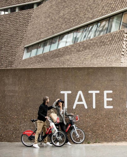 Two people outside the Tate Modern near Elephant Park